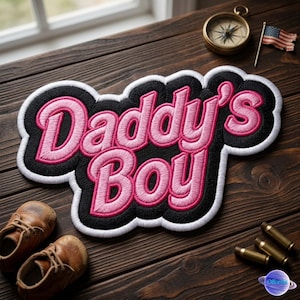 May include: A white ceramic mug with a black handle and the text "But First, Coffee" in a black, bold font. The mug is sitting on a wooden surface. The mug is approximately 4 inches tall.