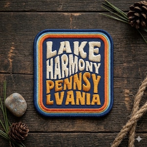 May include: A set of three ceramic canisters with lids. The canisters are white with a blue floral pattern. The largest canister is 8 inches tall, the medium is 6 inches, and the smallest is 4 inches.