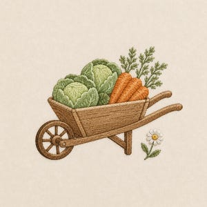 May include: An embroidery design featuring a brown wooden wheelbarrow filled with two light green cabbages and three orange carrots with green leafy tops. A single white daisy with a yellow center is positioned below the wheelbarrow on the fabric.