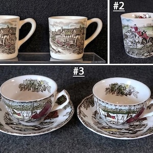 May include: A collection of ceramic drinkware featuring three distinct sets. Set #1 includes two mugs with a brown and green house illustration. Set #2 is a single mug with a hunting scene. Set #3 features two teacups and saucers with winter landscapes.