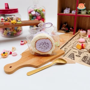 May include: A set of three ceramic mugs with a speckled, matte finish. Each mug features a different color: light blue, cream, and gray. The mugs have a simple, modern design and a comfortable handle.