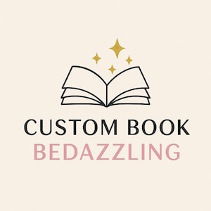 May include: A logo with an open book illustration and gold stars above it. The words "CUSTOM BOOK" are in black, and "BEDAZZLING" is in pink, set against a cream backdrop.