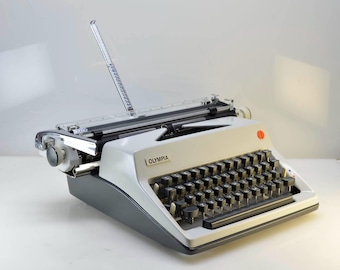 1970 Olympia SM9 Typewriter with RARE Wide Carriage Professionally Serviced Excellent Working Condition with Case, Vinyl Cover, Instructions