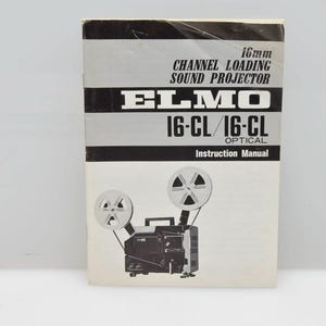 May include: Black and white instruction manual for a 16mm Elmo 16-CL/16-CL Optical Channel Loading Sound Projector. The cover features a diagram of the projector with two film reels.