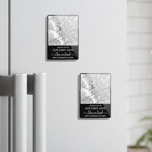 May include: Two rectangular black magnets with a map design. The magnets have the text "September 5th 2005" and "OUR FIRST DATE" with the names "Eleen & Daniel" and "WELL OF BRISBANE, SOUTH BANK" printed on them.