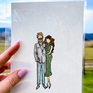 May include: Watercolor illustration of a couple in formal attire. The man wears a gray suit and the woman a green dress. The artwork is on white paper, held in a clear plastic sleeve. The background is a field and sky.