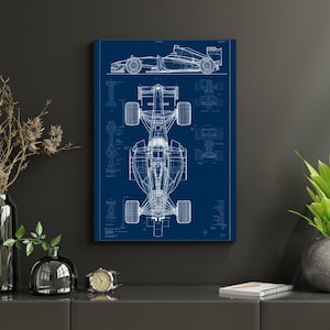 May include: A blue and white technical blueprint poster featuring a detailed line drawing of a Formula One race car. The artwork displays the vehicle from both a side profile and a top-down perspective, complete with grid lines and technical annotations.