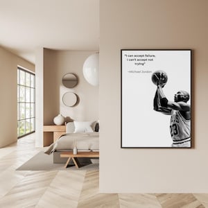 May include: Black and white framed print featuring Michael Jordan shooting a basketball. The print includes the quote "I can accept failure, I can't accept not trying" by Michael Jordan.