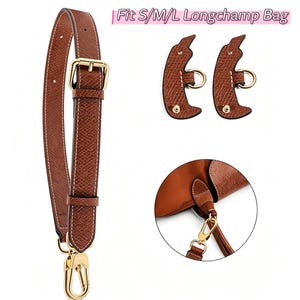 May include: Brown leather bag strap with gold-colored hardware, including a buckle and a clasp. The strap is shown with two matching leather pieces and a close-up of a bag attachment. Text reads: Fit S/M/L Longchamp Bag.
