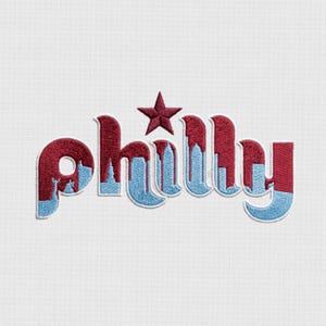 May include: Embroidered patch featuring the word "Philly" in a stylized design. The letters are primarily burgundy with a light blue skyline and accents. A burgundy star sits above the "h". The patch is on a white background.