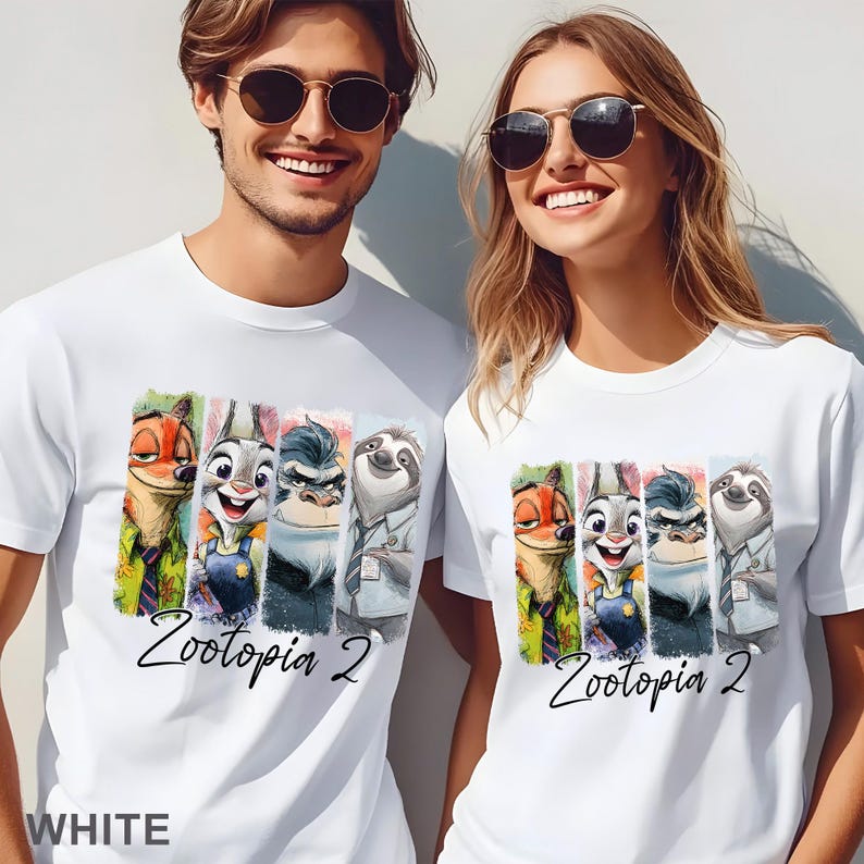 May include: White t-shirts with a colourful graphic of Zootopia characters. The design includes Nick Wilde, Judy Hopps, Chief Bogo, and Flash. The text "Zootopia 2" is written in a cursive font below the characters. The word "WHITE" is at the bottom of the t-shirts.