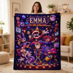 May include: A rectangular fleece blanket featuring a dark purple background with a vibrant, colorful illustration of various cartoon characters. The name EMMA is printed in large, gold, stylized letters at the top center of the design.