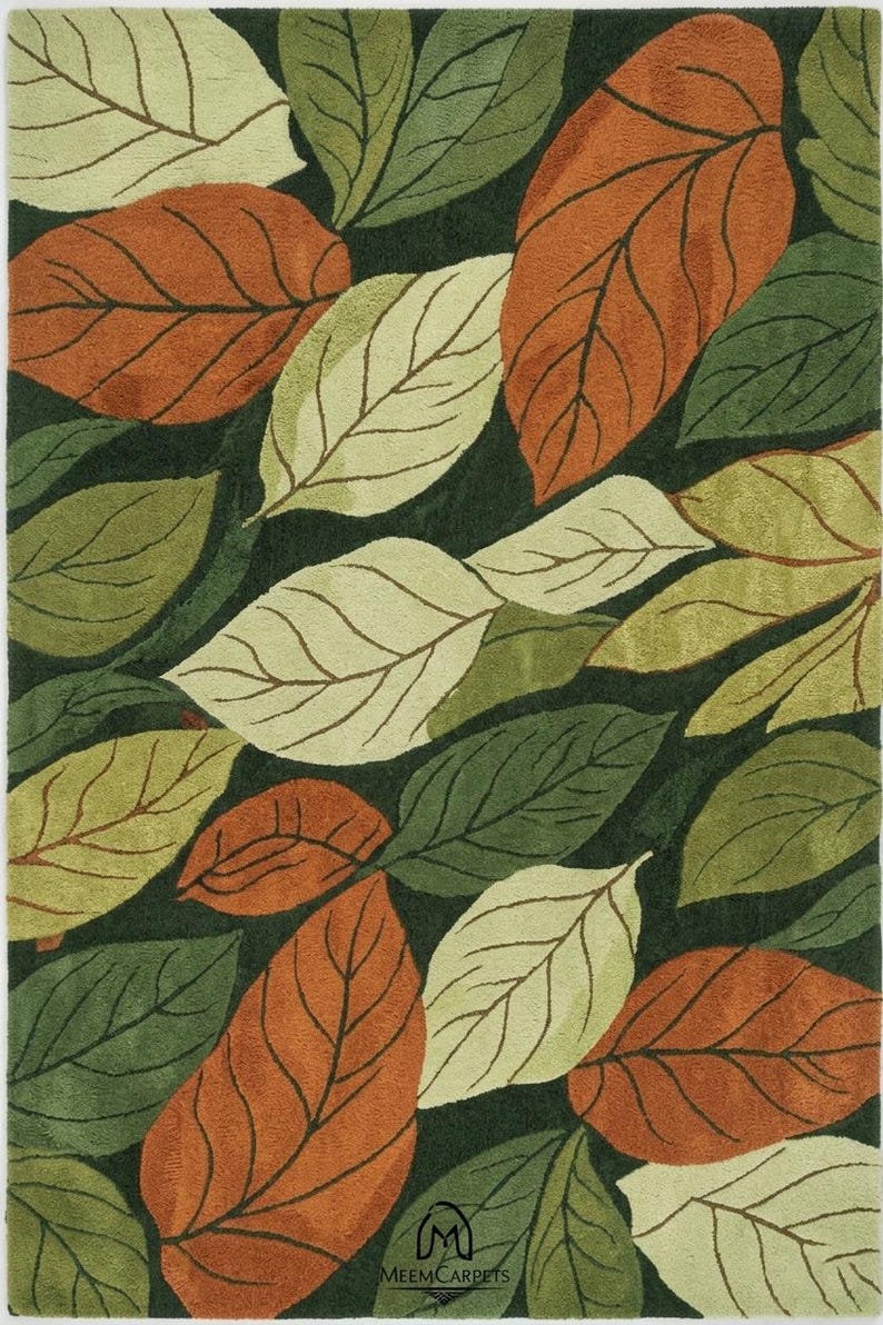 Hand tufted leaf pattern rug in olive green beige and rust colors