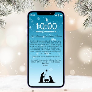 May include: A smartphone displays a lock screen with the time 10:00, Monday, December 01, and text from the St. Andrew Christmas Novena prayer. A silhouette of the Nativity scene is at the bottom.