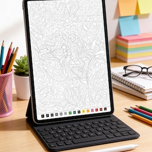 May include: A tablet computer with a black keyboard cover displaying a complex paint-by-number line art design on its screen. The interface includes a numbered color palette at the bottom. A white stylus rests on the surface in front of the device.