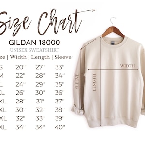 May include: A beige Gildan 18000 unisex sweatshirt displayed on a wooden hanger. A size chart is provided to the left, listing widths, lengths, and sleeve measurements in inches for sizes S through 5XL, with lines indicating where to measure.