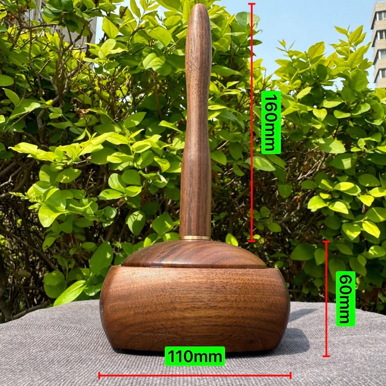May include: A wooden toilet brush with a dark brown finish. The brush is 160mm tall, with a base that is 110mm wide and 60mm tall. The handle has a gold-colored accent near the base.