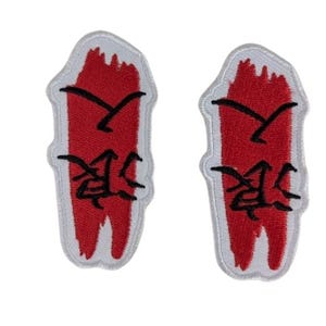 May include: Two embroidered patches with a red background and black Japanese characters. The patches have a white border and are rectangular with a curved bottom. The patches are from Patchmaster Threads.