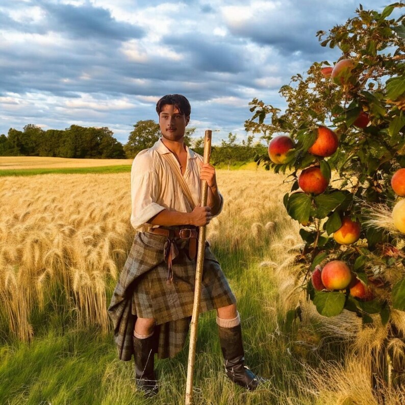 May include: A person wearing a cream-coloured long-sleeved shirt and a grey and brown plaid kilt with a brown leather belt. The person is holding a tall wooden staff while standing in a field of golden wheat next to an apple tree with red fruit.