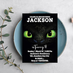 May include: A black birthday invitation featuring a dragon's face with bright green eyes. The invitation reads "CALLING ALL DRAGON RIDERS" and "JACKSON" in white text. Additional text includes party details and RSVP information.