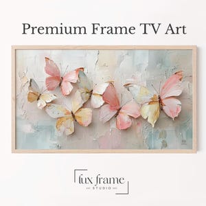 May include: Rectangular framed artwork featuring a textured background with pastel colors. The artwork showcases several butterflies in shades of pink, yellow, and white. The text "Premium Frame TV Art" is at the top.