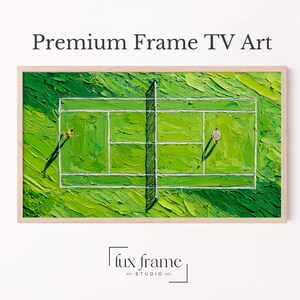 May include: A framed artwork showing a tennis court with two players. The court is painted in shades of green with white lines, and the players are small figures. The artwork is labelled "Premium Frame TV Art" and is framed in a light wood.