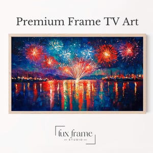 Peut inclure: Impression numérique encadrée représentant un feu d'artifice coloré au-dessus de l'eau. L'œuvre présente des éclats de lumière rouges, oranges, bleus et blancs se reflétant dans l'eau. Le texte "Premium Frame TV Art" est en haut.