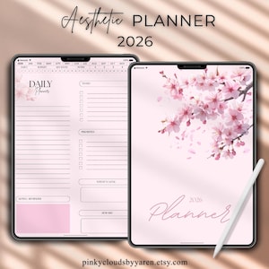 Könnte beinhalten: Zwei digitale Planer auf Tablets. Das linke Tablet zeigt ein tägliches Planer-Layout mit rosa floralen Akzenten und dem Text "DAILY Planner". Das rechte Tablet zeigt ein rosa Blumendesign mit dem Wort "Planner" und dem Jahr "2026".