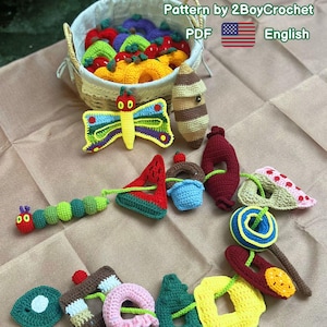 May include: A collection of colorful, crocheted toy food and caterpillar-themed items. Includes a caterpillar, butterfly, watermelon slice, ice cream cone, and other shapes. The text "Kids Toy Caterpillar" is at the top.