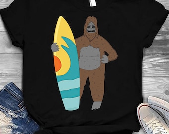 The Big LEZ Show Merch Holding Day on Beach T Shirt