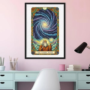 May include: Framed art print of a tarot card titled "The Cosmic River." The artwork features a swirling galaxy design with a bearded figure holding a glowing orb. The card has a decorative border with celestial and floral elements.