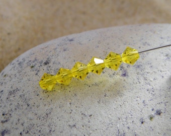 Swarovski Crystal - Yellow Bicone 4 mm - Packet of 12