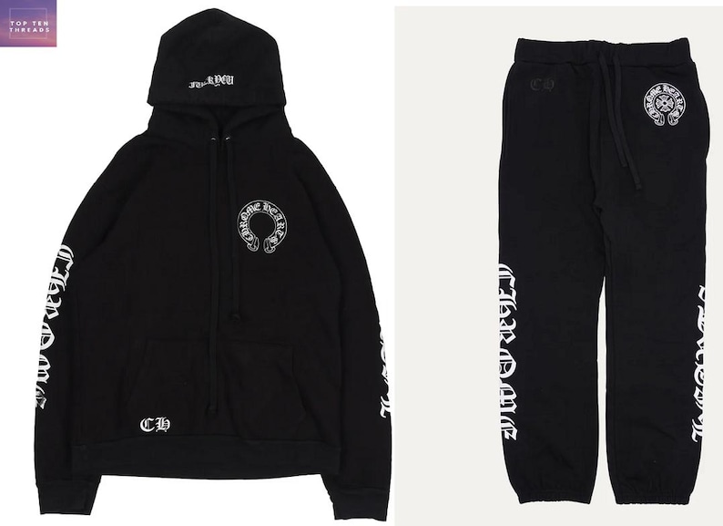May include: Black hoodie and joggers set. The hoodie has a hood with text, a front pocket, and a white logo on the chest. The sleeves have white text. The joggers have a drawstring waist and a white logo. The set is made of a soft material.
