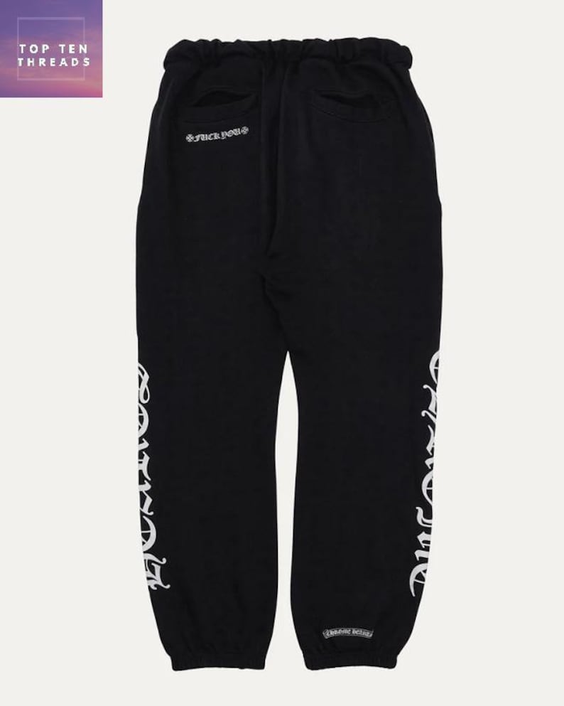 May include: Black sweatpants with white lettering down the side and on the back. The text on the back says "*FUCK YOU*". The sweatpants have a drawstring waist and pockets. The brand name "TOP TEN THREADS" is in the top left corner.