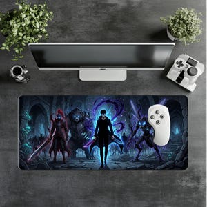May include: A rectangular desk mat featuring a dark fantasy illustration of a central figure surrounded by a bear, a knight in red armour, and a winged creature, all set against a stone dungeon background with glowing blue and purple energy effects.