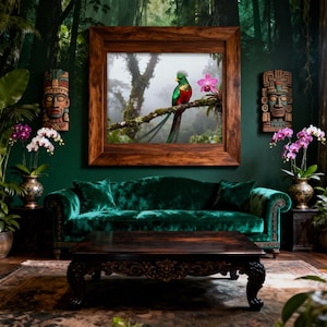 May include: A living room with a dark green velvet sofa and a dark wood coffee table. A large framed picture of a bird sits above the sofa. Two carved wooden masks and potted orchids flank the picture, creating a tropical theme.