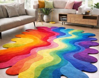 May include: A vibrant, rainbow-colored area rug with a unique, flowing design. The rug features a spectrum of colors, from red and orange to yellow, green, blue, and purple. Its irregular shape adds a modern touch to the room's decor.