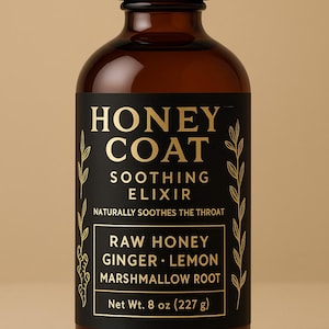 May include: A brown glass bottle with a black label featuring gold text that reads "HONEY COAT SOOTHING ELIXIR." The label also lists ingredients: raw honey, ginger, lemon, and marshmallow root. The bottle contains 8 oz (227 g) of product.