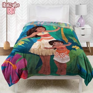 May include: A plush blanket featuring a colorful graphic print of two animated characters in a tropical setting with green foliage and large pink hibiscus flowers. The design depicts a taller character and a smaller character wearing traditional island-style clothing, including patterned skirts and tops, set against a vibrant jungle background.