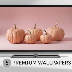 May include: A flat-screen TV displays five peach-colored pumpkins against a pink background. The pumpkins vary in size, with visible stems. The text "5 PREMIUM WALLPAPERS" is displayed at the bottom of the screen.