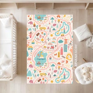 May include: A children's play mat with a playful road map design. The mat features illustrations of cars, trains, buildings, animals, and trees. The background is light pink, with a network of roads and various landmarks.