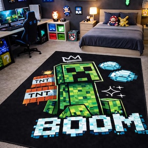 May include: Black rectangular rug featuring a pixelated green Creeper character with a crown, TNT blocks, and the word "BOOM" in blue and white. The rug is in a gaming-themed bedroom with a bed, desk, and wall decorations.