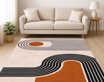 May include: A rectangular rug with a contemporary geometric pattern. The rug has a cream backdrop with black curved and straight lines, and burnt orange circular and rectangular shapes. The rug is positioned in front of a beige sofa.