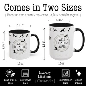 May include: Two white ceramic mugs with black handles and rims. The mugs have a bat and circle design with the text "WELL THE FUCK AWARE." The smaller mug is 3.74 inches tall, and the larger mug is 4.61 inches tall.