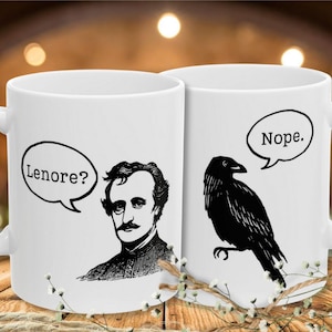 May include: Two white ceramic mugs with black graphics. One mug features a portrait of a man with the text "Lenore?" in a speech bubble. The other mug has a black raven with the word "Nope." in a speech bubble.