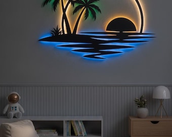 May include: A black metal wall art piece featuring a tropical island scene with two palm trees, a setting sun, and a bird in flight. The circular frame is backlit with integrated LED lighting that glows in shades of green, white, and blue.
