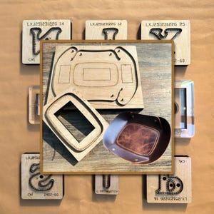 May include: A selection of leathercraft tools and a finished leather tray. The tools include wooden die-cut molds and a leather tray with a brown interior and a darker brown exterior. The wooden molds have text and numbers.