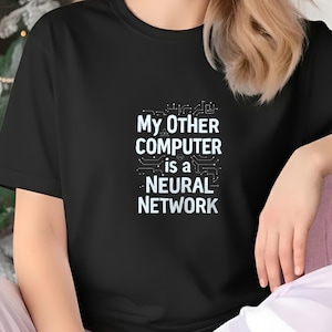 May include: Black t-shirt with the text "My Other Computer is a Neural Network" in white. The text is arranged in three lines with a circuit board design above and below the text. The shirt is a crew neck and short-sleeved.