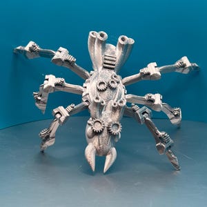 May include: A silver, 3D printed, steampunk-style spider with multiple articulated legs and a detailed, intricate design.
