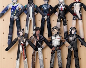 May include: A collection of nine flat, plush character dolls featuring diverse anime-style designs, including various outfits, hair colors, and accessories. The dolls are arranged in two rows, displaying detailed printed clothing and distinct facial expressions.